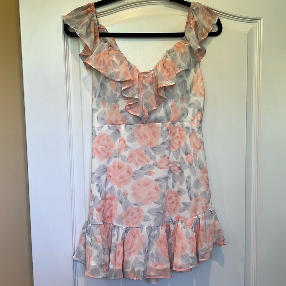 This is a flowy mink pink and grey dress.